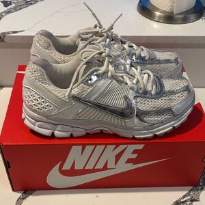 Nike women White and Metallic Sneakers